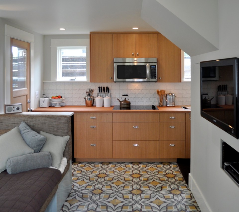 This tiny 2-storey guest cottage has one bedroom in 342 sq ft. | www.facebook.com/SmallHouseBliss