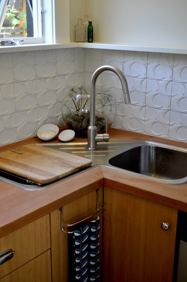 This tiny 2-storey guest cottage has one bedroom in 342 sq ft. | www.facebook.com/SmallHouseBliss