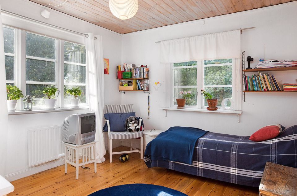 Tucked in the forest on a small island near Stockholm, this vacation cottage has three bedrooms in 700 sq ft. | www.facebook.com/SmallHouseBliss