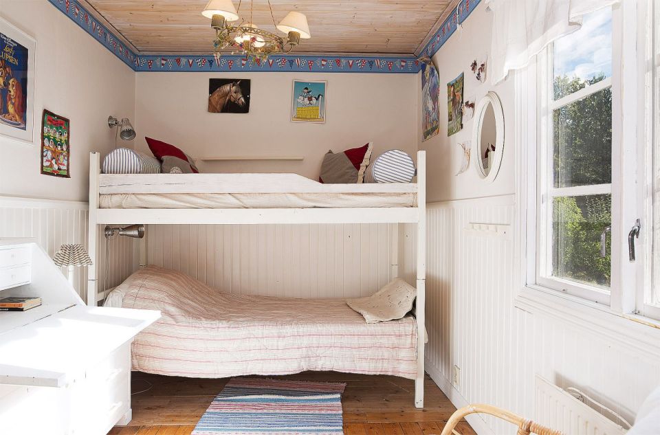 Tucked in the forest on a small island near Stockholm, this vacation cottage has three bedrooms in 700 sq ft. | www.facebook.com/SmallHouseBliss