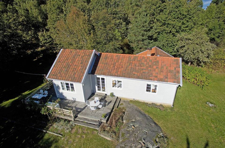 Tucked in the forest on a small island near Stockholm, this vacation cottage has three bedrooms in 700 sq ft. | www.facebook.com/SmallHouseBliss