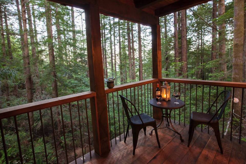 Owl Tree Cabin, a tiny cabin that feels like a treehouse. It has a compact kitchen and bathroom on the 225 sq ft main level plus a loft bedroom. | www.facebook.com/SmallHouseBliss