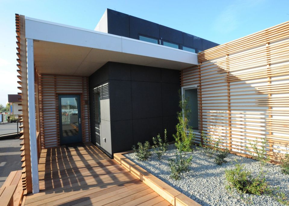 INhouse, an entry at Solar Decathlon 2015, has a covering of redwood strips to shade the walls and keep the home cooler. It has one bedroom plus a flex space in 986 sq ft. | www.facebook.com/SmallHouseBliss