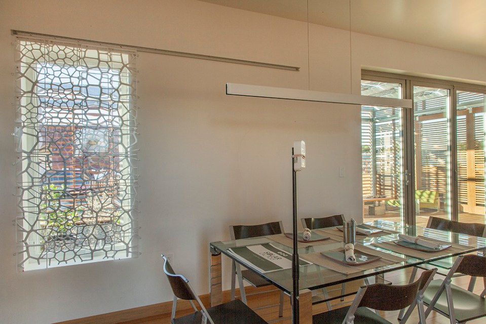 INhouse, an entry at Solar Decathlon 2015, has a covering of redwood strips to shade the walls and keep the home cooler. It has one bedroom plus a flex space in 986 sq ft. | www.facebook.com/SmallHouseBliss