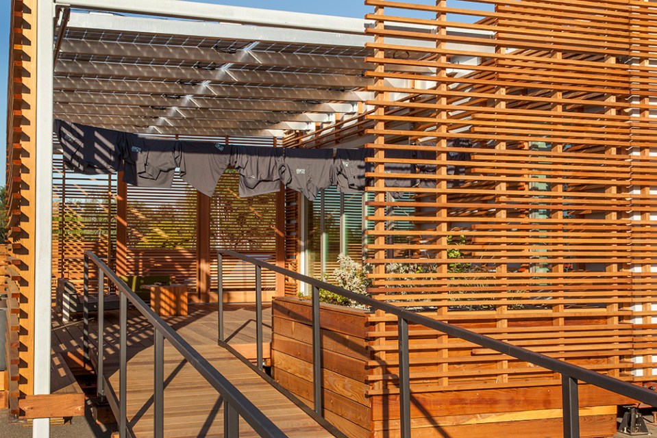 INhouse, an entry at Solar Decathlon 2015, has a covering of redwood strips to shade the walls and keep the home cooler. It has one bedroom plus a flex space in 986 sq ft. | www.facebook.com/SmallHouseBliss