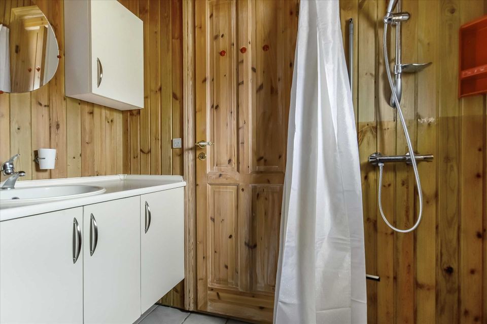 This tiny sod-roofed house sits among the sand dunes in northern Denmark. It has one bedroom in 430 sq ft. | www.facebook.com/SmallHouseBliss