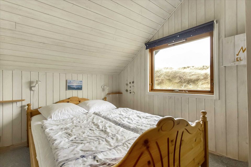 This tiny sod-roofed house sits among the sand dunes in northern Denmark. It has one bedroom in 430 sq ft. | www.facebook.com/SmallHouseBliss