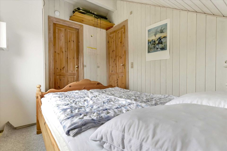 This tiny sod-roofed house sits among the sand dunes in northern Denmark. It has one bedroom in 430 sq ft. | www.facebook.com/SmallHouseBliss