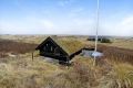 This tiny sod-roofed house sits among the sand dunes in northern Denmark. It has one bedroom in 430 sq ft. | www.facebook.com/SmallHouseBliss