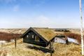 This tiny sod-roofed house sits among the sand dunes in northern Denmark. It has one bedroom in 430 sq ft. | www.facebook.com/SmallHouseBliss