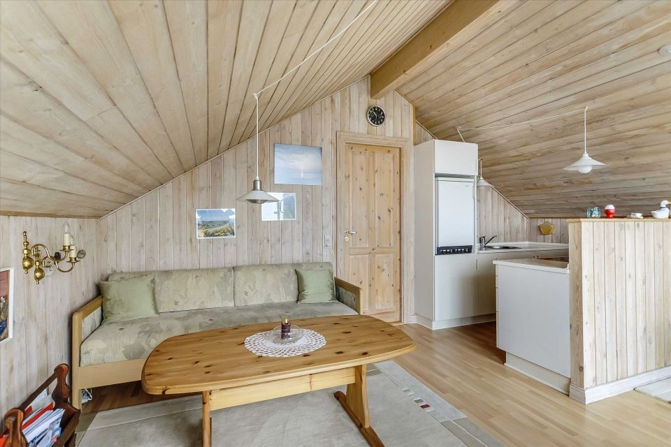 This tiny sod-roofed house sits among the sand dunes in northern Denmark. It has one bedroom in 430 sq ft. | www.facebook.com/SmallHouseBliss