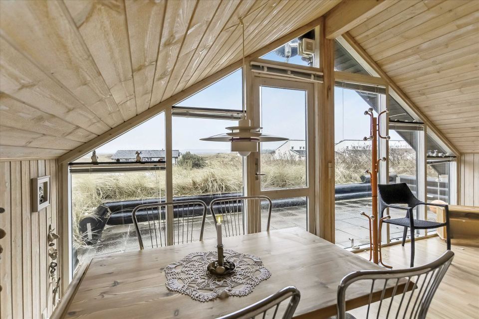 This tiny sod-roofed house sits among the sand dunes in northern Denmark. It has one bedroom in 430 sq ft. | www.facebook.com/SmallHouseBliss