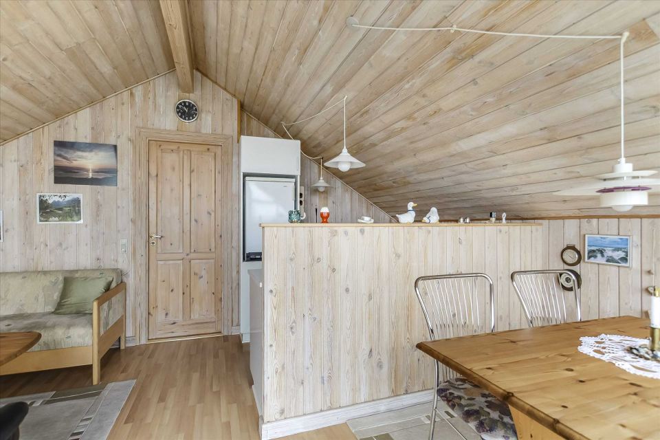 This tiny sod-roofed house sits among the sand dunes in northern Denmark. It has one bedroom in 430 sq ft. | www.facebook.com/SmallHouseBliss