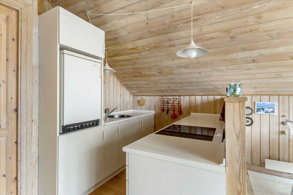 This tiny sod-roofed house sits among the sand dunes in northern Denmark. It has one bedroom in 430 sq ft. | www.facebook.com/SmallHouseBliss