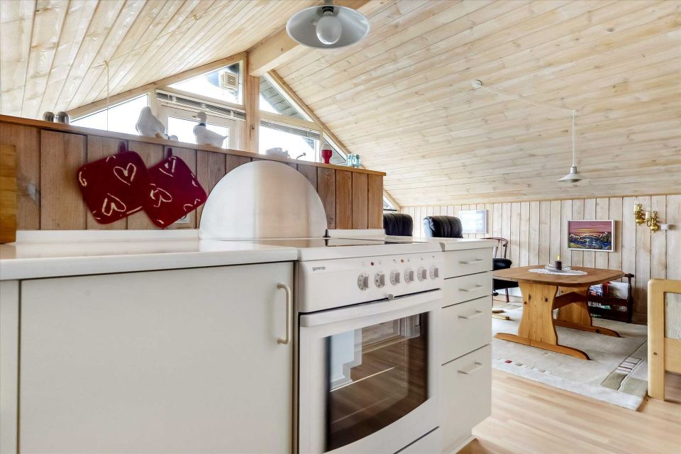 This tiny sod-roofed house sits among the sand dunes in northern Denmark. It has one bedroom in 430 sq ft. | www.facebook.com/SmallHouseBliss