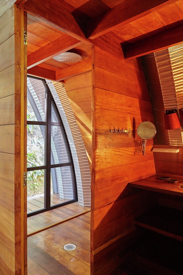 "Arca", an arched retreat in the Brazilian rainforest created from a prefab metal building. It has two bedrooms in 781 sq ft. | www.facebook.com/SmallHouseBliss