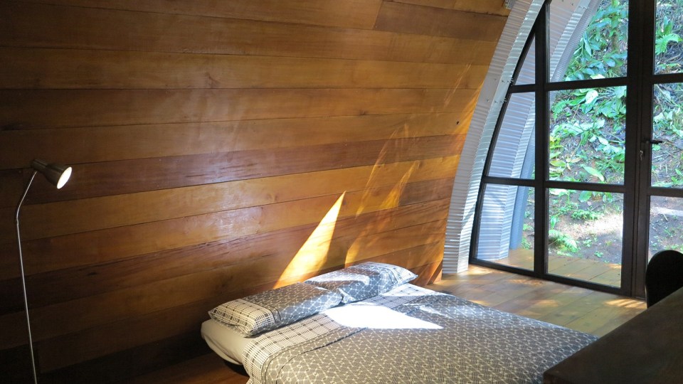 "Arca", an arched retreat in the Brazilian rainforest created from a prefab metal building. It has two bedrooms in 781 sq ft. | www.facebook.com/SmallHouseBliss