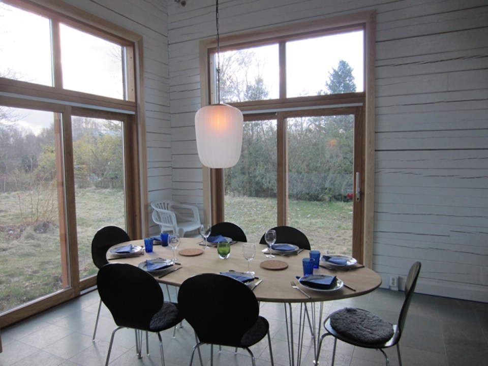 A vacation cabin in Sweden built in the regions's vernacular style with dovetailed log walls and a living green roof. It has two bedrooms and a loft in roughly 750 sq ft. | www.facebook.com/SmallHouseBliss