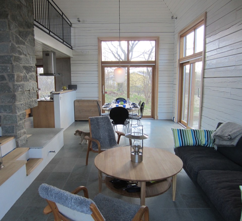 A vacation cabin in Sweden built in the regions's vernacular style with dovetailed log walls and a living green roof. It has two bedrooms and a loft in roughly 750 sq ft. | www.facebook.com/SmallHouseBliss