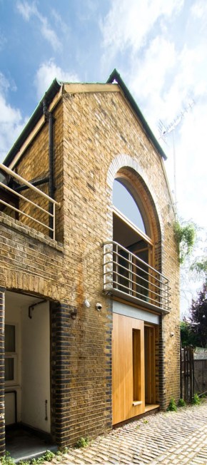 A brick coach house in London dating back to the 1800s was renovated with a new interior that makes extensive use of birch plywood. | www.facebook.com/SmallHouseBliss