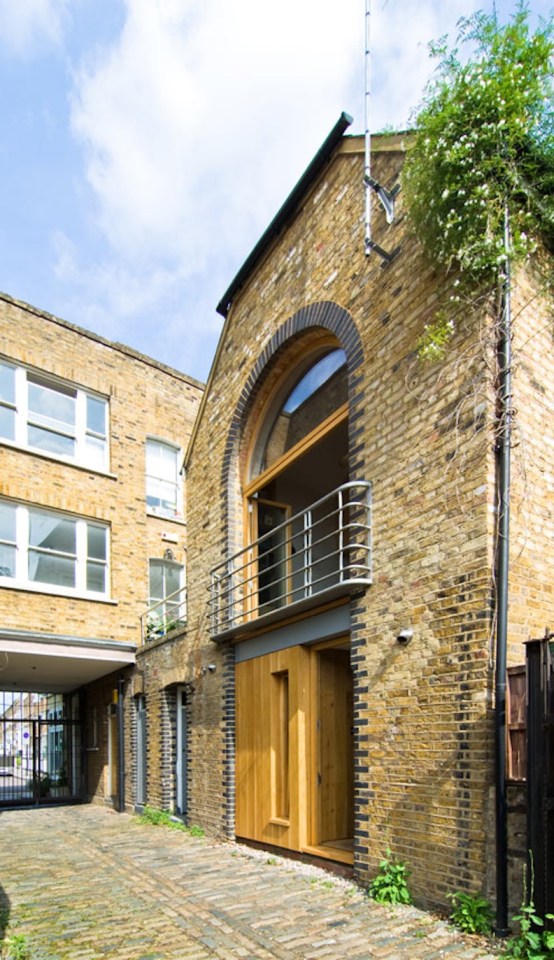 A brick coach house in London dating back to the 1800s was renovated with a new interior that makes extensive use of birch plywood. | www.facebook.com/SmallHouseBliss