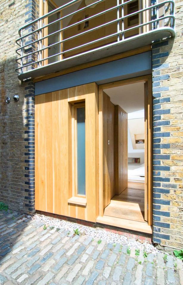 A brick coach house in London dating back to the 1800s was renovated with a new interior that makes extensive use of birch plywood. | www.facebook.com/SmallHouseBliss