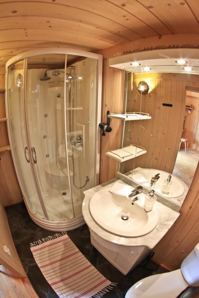 This tiny log cabin provides a snug and romantic retreat for couples. | www.facebook.com/SmallHouseBliss