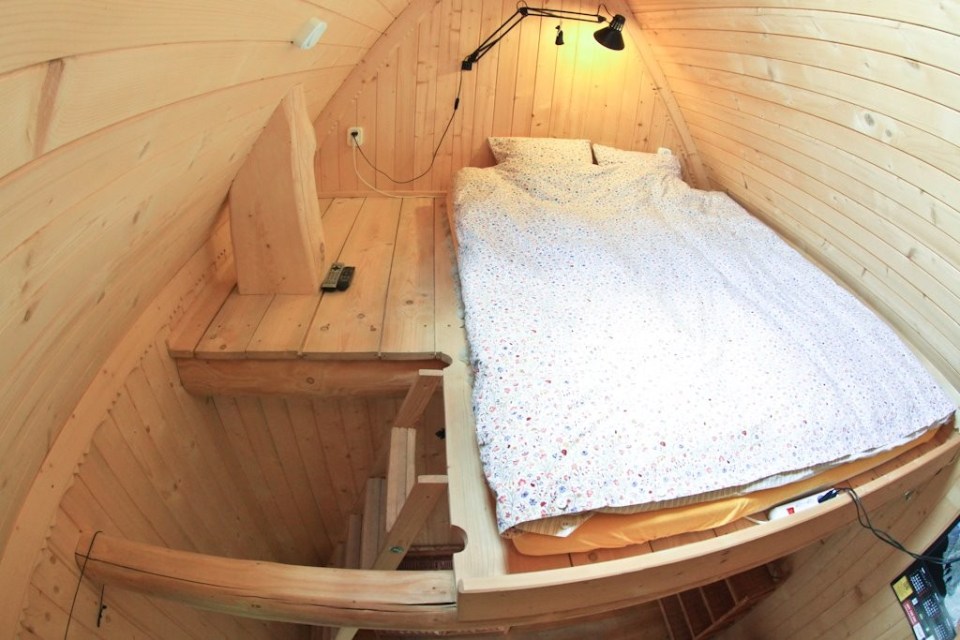 This tiny log cabin provides a snug and romantic retreat for couples. | www.facebook.com/SmallHouseBliss