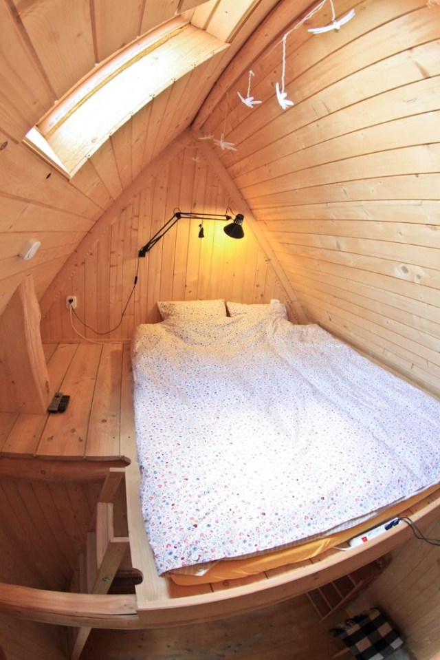 This tiny log cabin provides a snug and romantic retreat for couples. | www.facebook.com/SmallHouseBliss