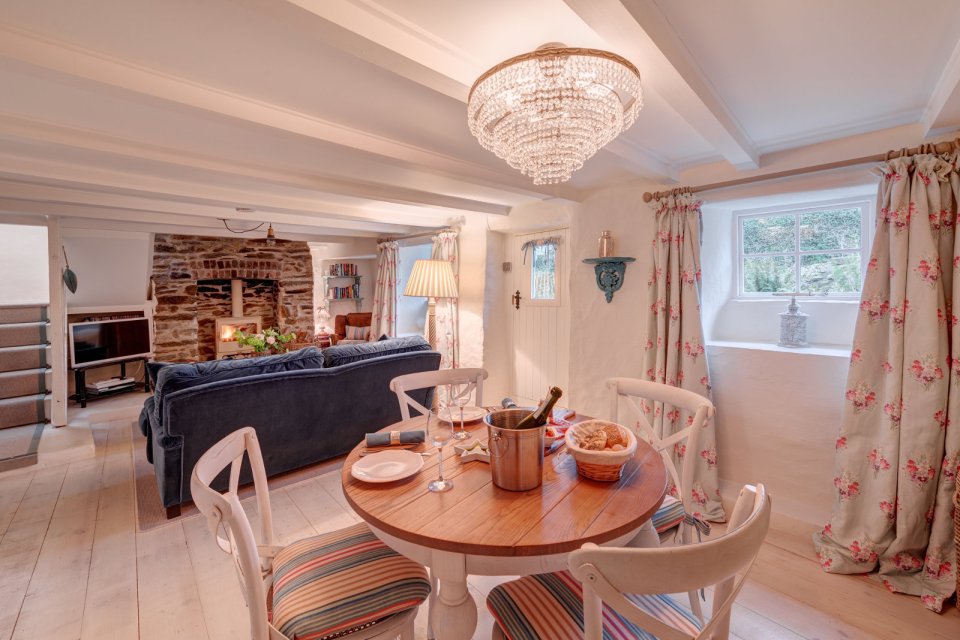 Sweetpea Cottage, a 300-year-old plastered stone cottage in Cornwall. The two-bedroom cottage was built in 1680 and recently updated in a "vintage country glamour" style to brighten the interior. | www.facebook.com/SmallHouseBliss