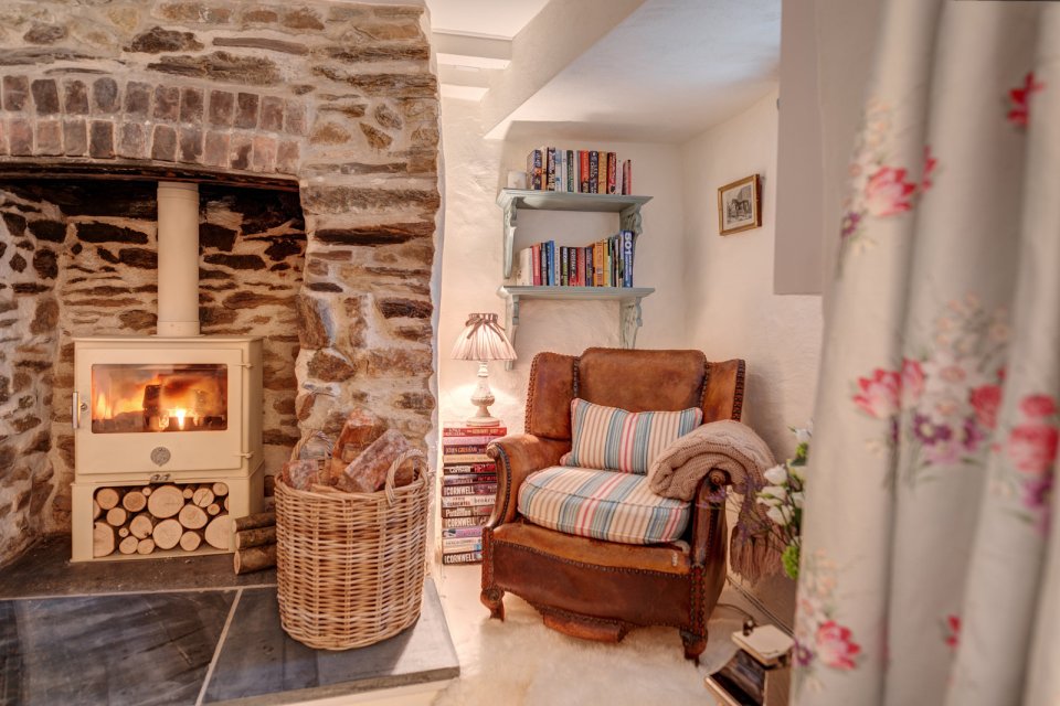 Sweetpea Cottage, a 300-year-old plastered stone cottage in Cornwall. The two-bedroom cottage was built in 1680 and recently updated in a "vintage country glamour" style to brighten the interior. | www.facebook.com/SmallHouseBliss