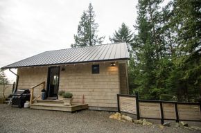 This contemporary coastal cottage has an open floor plan with one bedroom in 600 sq ft. | www.facebook.com/SmallHouseBliss