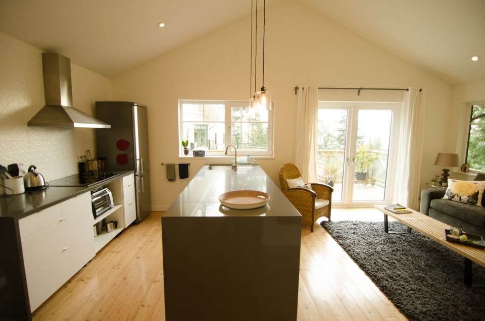 This contemporary coastal cottage has an open floor plan with one bedroom in 600 sq ft. | www.facebook.com/SmallHouseBliss