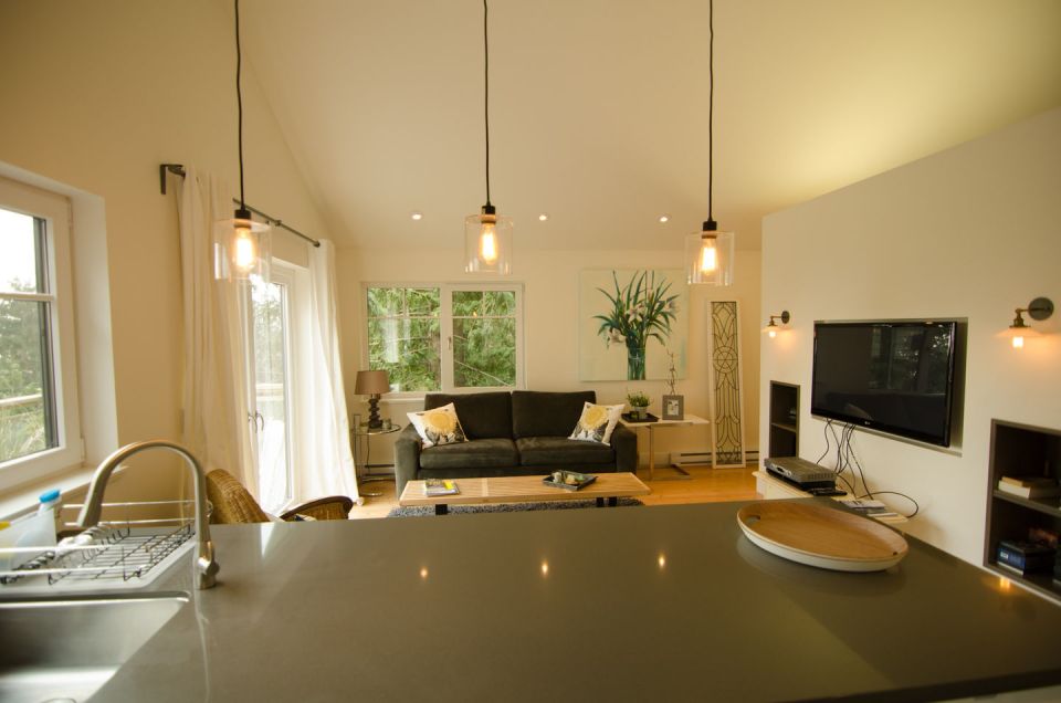 This contemporary coastal cottage has an open floor plan with one bedroom in 600 sq ft. | www.facebook.com/SmallHouseBliss
