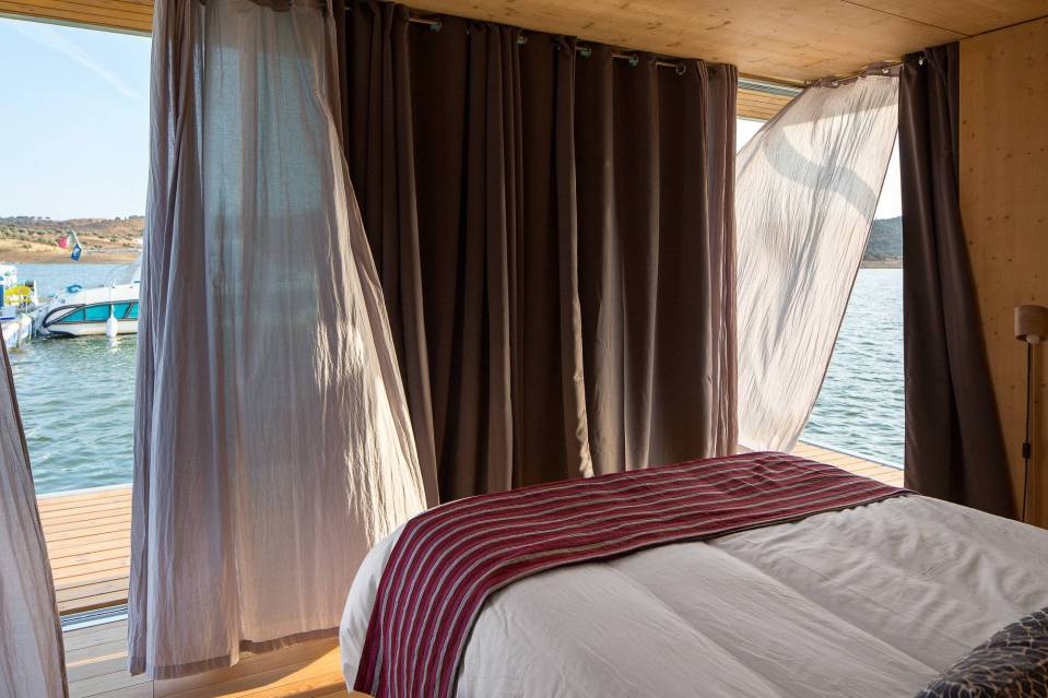 Floatwing, a line of houseboats that can be equipped for autonomous off-grid living. This one has one bedroom in 561 sq ft. | www.facebook.com/SmallHouseBliss