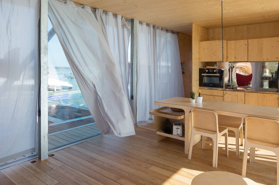 Floatwing, a line of houseboats that can be equipped for autonomous off-grid living. This one has one bedroom in 561 sq ft. | www.facebook.com/SmallHouseBliss