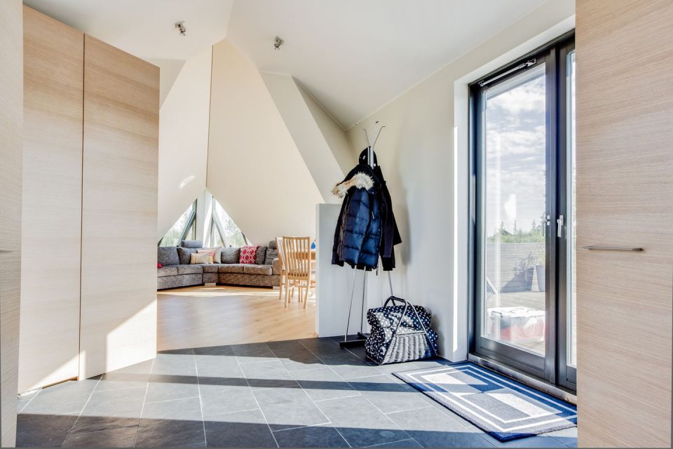 Iceland's volcanoes were the inspiration for this stunning pyramid-shaped vacation cottage. It has three small bedrooms plus a loft. | www.facebook.com/SmallHouseBliss