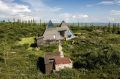 Iceland's volcanoes were the inspiration for this stunning pyramid-shaped vacation cottage. It has three small bedrooms plus a loft. | www.facebook.com/SmallHouseBliss