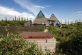 Iceland's volcanoes were the inspiration for this stunning pyramid-shaped vacation cottage. It has three small bedrooms plus a loft. | www.facebook.com/SmallHouseBliss