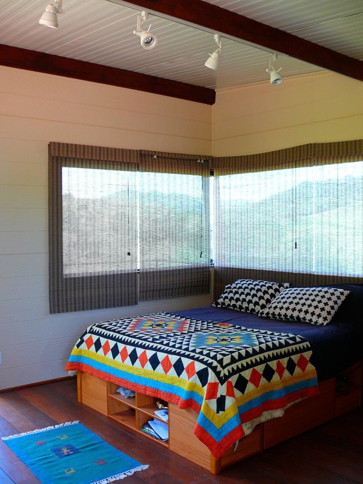 Casa em Guararema is a small wooden house in Brazil perched on eucalyptus poles. It has one bedroom in roughly 460 sq ft. | www.facebook.com/SmallHouseBliss