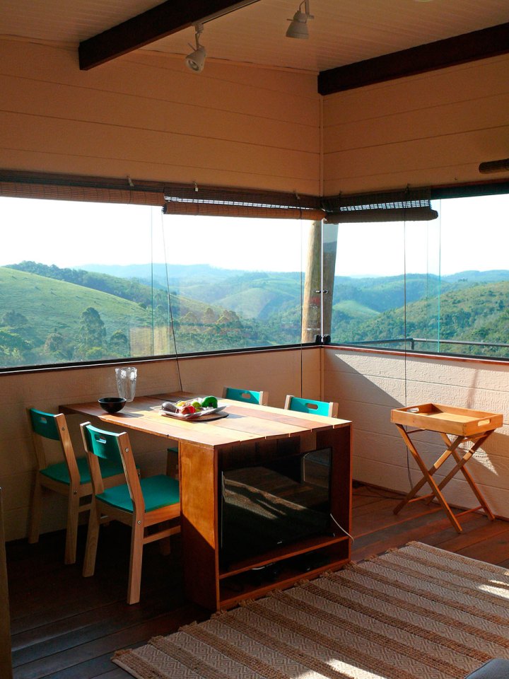 Casa em Guararema is a small wooden house in Brazil perched on eucalyptus poles. It has one bedroom in roughly 460 sq ft. | www.facebook.com/SmallHouseBliss
