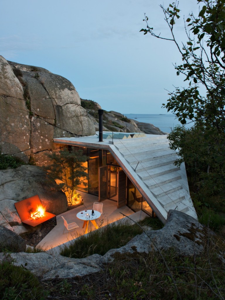 Image showcasing A modern cabin tucked into a rocky Norwegian coastline | Lund Hagem ...