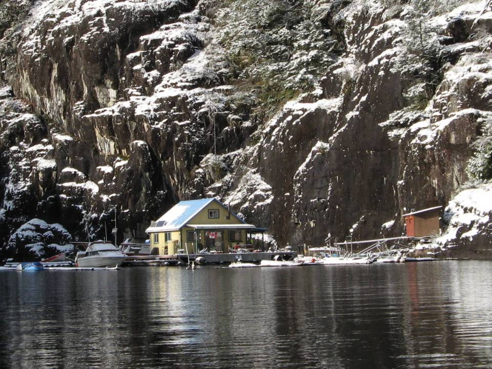 An off-grid floating cabin on Powell Lake, British Columbia. Built on a raft of cedar logs, the 675 sq ft cabin has 2 small bedrooms and a loft. | www.facebook.com/SmallHouseBliss