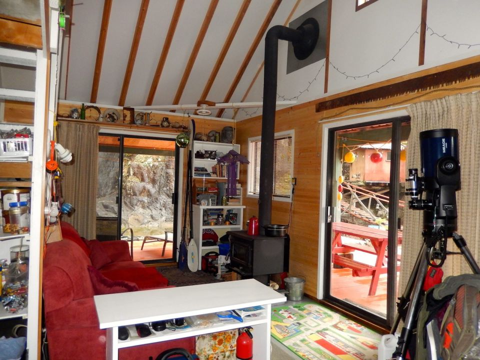 An off-grid floating cabin on Powell Lake, British Columbia. Built on a raft of cedar logs, the 675 sq ft cabin has 2 small bedrooms and a loft. | www.facebook.com/SmallHouseBliss