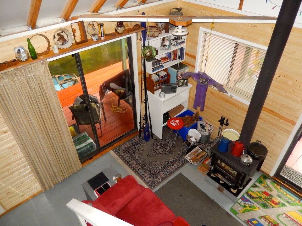 An off-grid floating cabin on Powell Lake, British Columbia. Built on a raft of cedar logs, the 675 sq ft cabin has 2 small bedrooms and a loft. | www.facebook.com/SmallHouseBliss