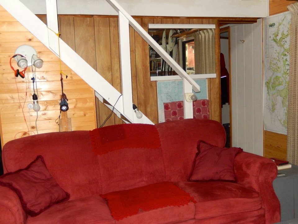 An off-grid floating cabin on Powell Lake, British Columbia. Built on a raft of cedar logs, the 675 sq ft cabin has 2 small bedrooms and a loft. | www.facebook.com/SmallHouseBliss