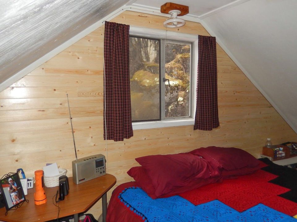 An off-grid floating cabin on Powell Lake, British Columbia. Built on a raft of cedar logs, the 675 sq ft cabin has 2 small bedrooms and a loft. | www.facebook.com/SmallHouseBliss