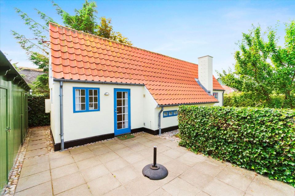 This tiny cottage in Denmark was built in 1925 and later expanded. It now has a 420 sq ft main level with one bedroom plus an attic bedroom. | www.facebook.com/SmallHouseBliss