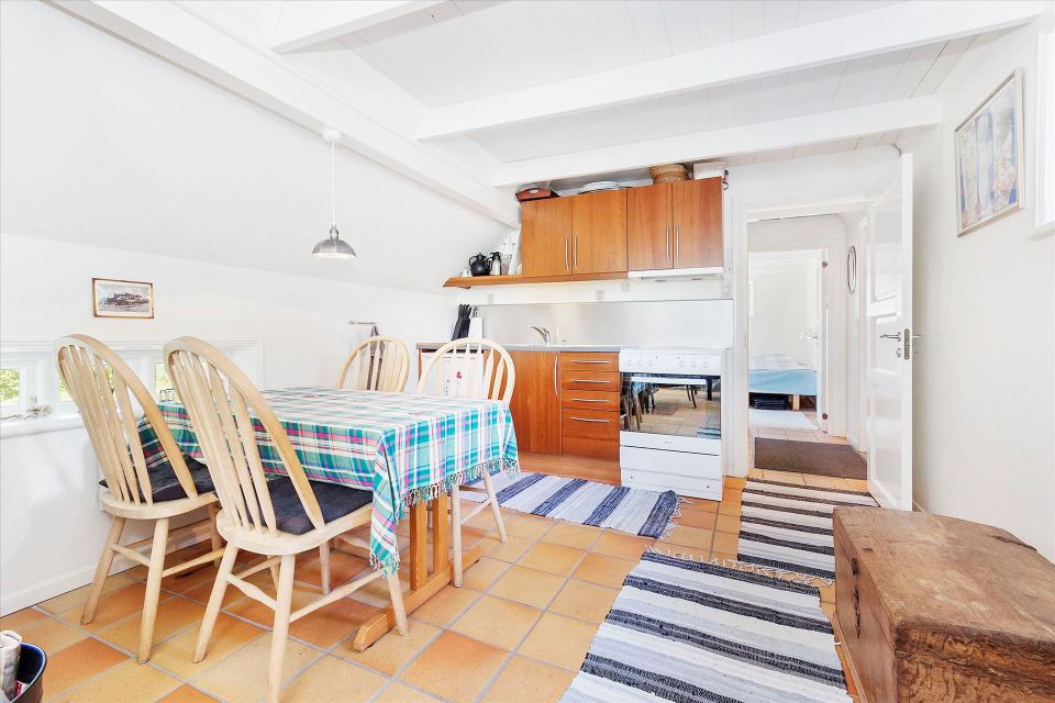 This tiny cottage in Denmark was built in 1925 and later expanded. It now has a 420 sq ft main level with one bedroom plus an attic bedroom. | www.facebook.com/SmallHouseBliss