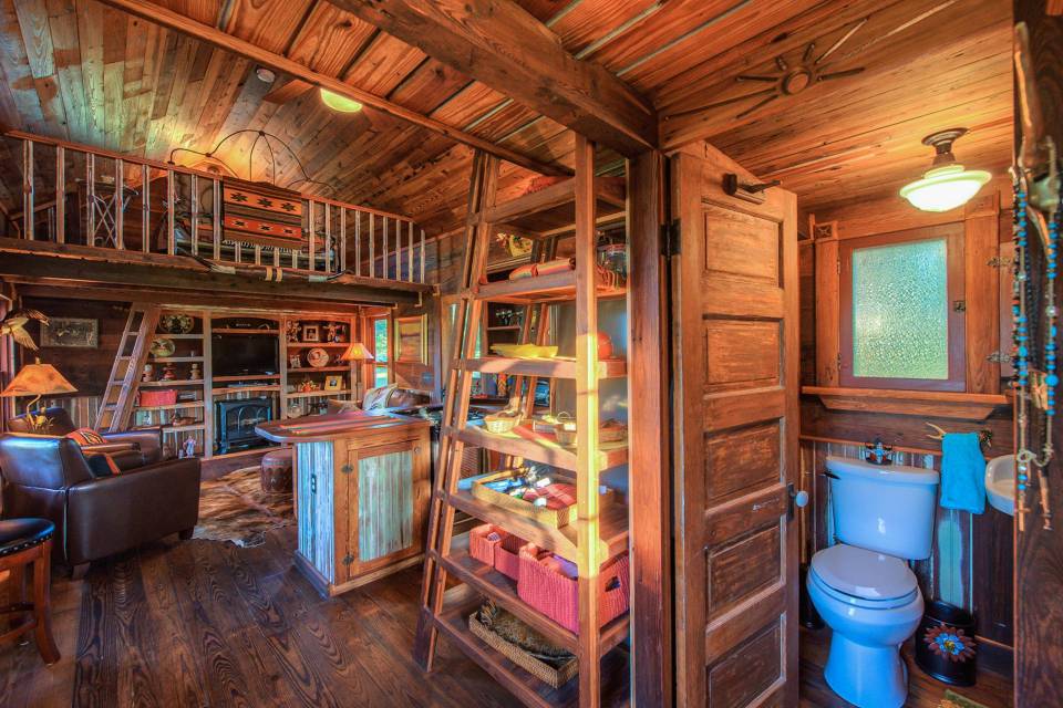 The rustic Cowboy Cabin was built from salvaged materials. The 12'x28' cabin has 2 sleeping lofts. | www.facebook.com/SmallHouseBliss